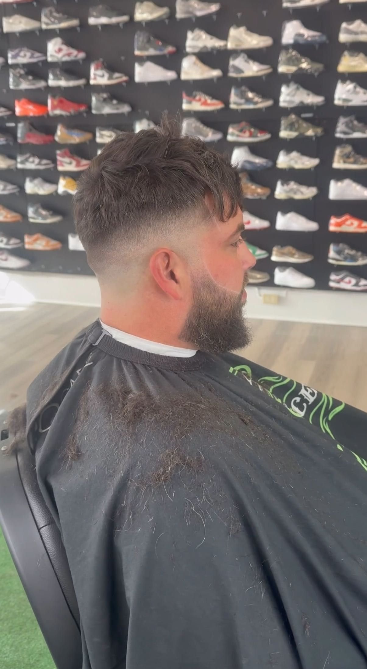 Fade in front of the sneaker wall at Faded Laces
